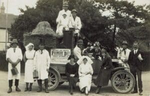several people dressed as nurses etc on a carnival float